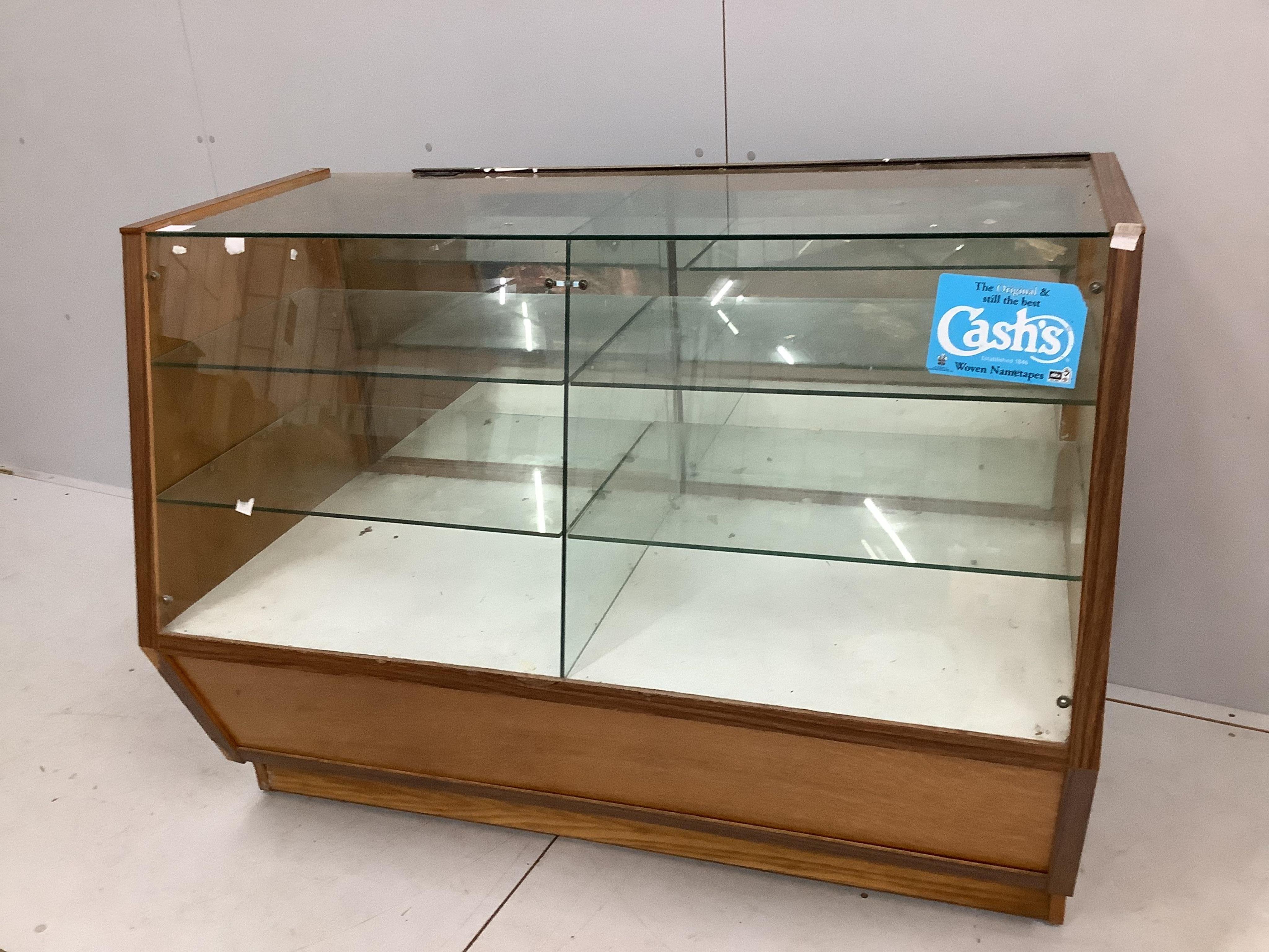 A mid century glazed haberdasher's shop counter cabinet, width 123cm, depth 60cm, height 92cm. Condition - fair